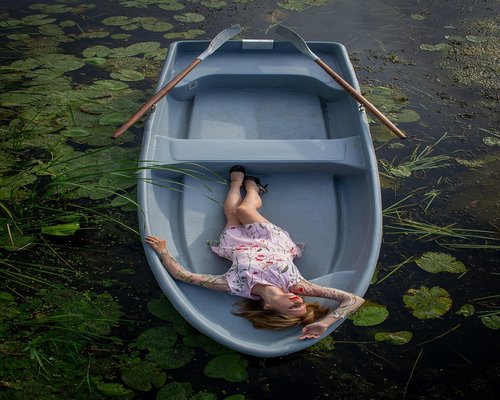 Woman enjoying a peaceful view from a window in a comfortable room